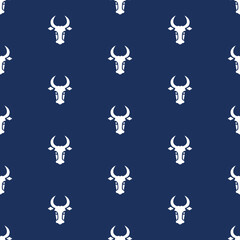 A seamless pattern with white bison on blue background. Animal wallpaper. 