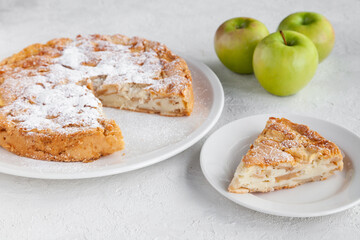 Homemade apple pie charlotte and piece of cake on plate
