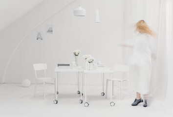 Blurred Woman in White Interior