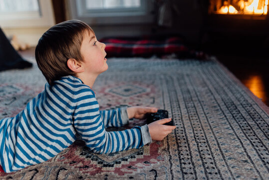 boy in family room playing video games