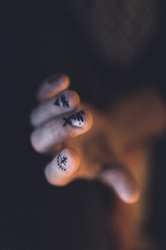 A man's hand with negative space nail art