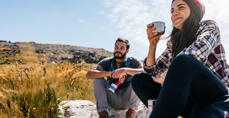 Friends taking break during hike