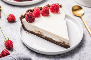 Homemade cheesecake with fresh raspberries. Delicious cheese cake with berries, healthy organic summer dessert pie