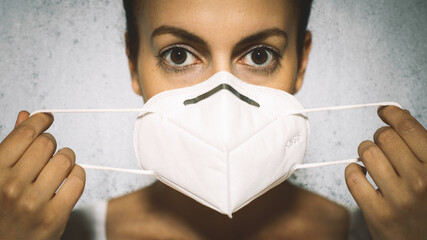 Caucasian Female protecting herself from viruses while wearing special mask
