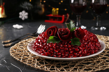 Salad Pomegranate bracelet on dark background. Traditional Russian New Year's festive salad, Closeup