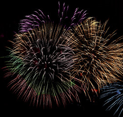 Obraz premium Colorful fireworks on black sky background