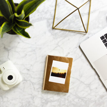 Images over stylish marble desk