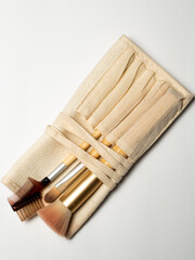 Close-up of makeup brushes on white background