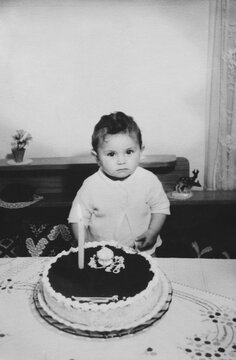 Young girl celebrating her first birthday in 1966