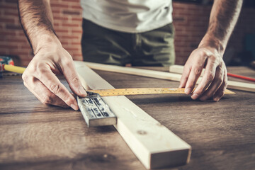 Carpenter measurement on a wooden plank