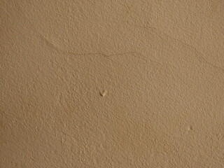 Background from a beige painted wall close-up.