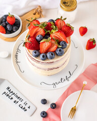 Red Velvet cake, viewed from the top, fruits, and decorations.