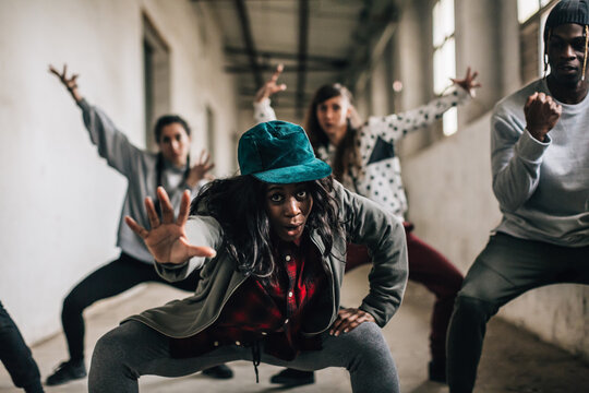 Hip hop team dancing in an old factory.