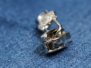 A metal slider zipper so close, jeans background