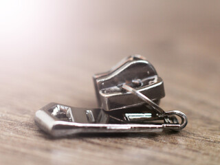 A metal slider zipper so close