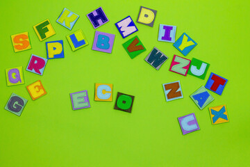 Alphabet. All letters of the alphabet in one place. Multicolored, beautiful letters. ABC. Occupation with children. Learning letters. English. Green background. Word ECO