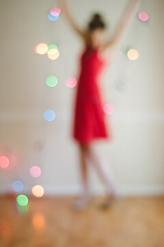 bokeh red dress woman and holiday lights