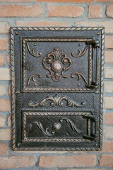 iron door of an old traditional brick oven. High quality photo