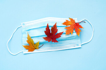 Protective face mask on blue background. The concept of seasonal allergies, flu and quarantine.
