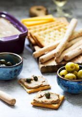 Chicken liver, onion and carrot paste, served with crackers, grissini, olives, capers and champagne.