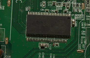 microchip on green electronic pcb closeup