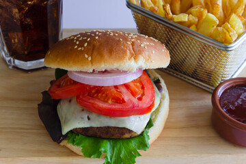 Cheeseburger with Fries and Cold Cola on Wood Board , on White Background