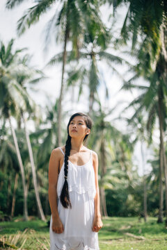 Woman in coconut jungle