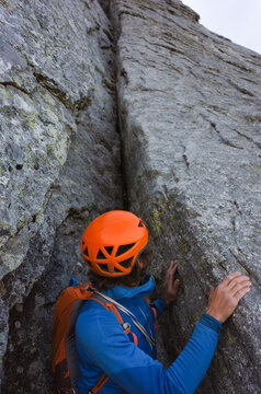 Male alpinist looking for a way to continue his ascension