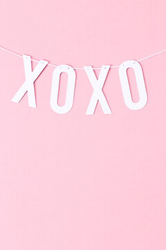 Hugs and kisses on a string vertical