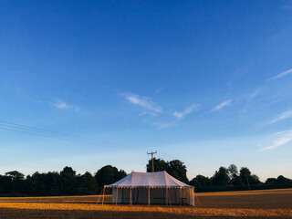 Vintage marquee tent in a wheat field