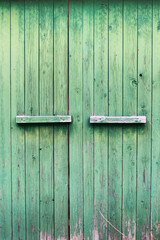 Green wooden barn door