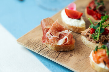 Closeup on assorted tappas with different toppings