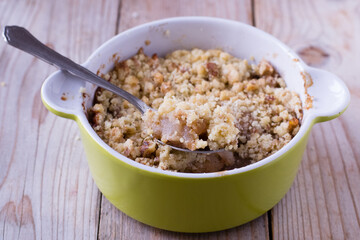 Apple crumble on wooden table