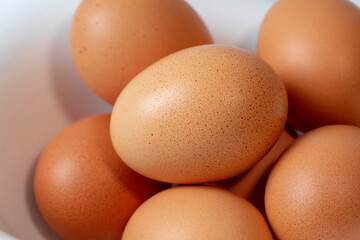 Eggs in a white magnetic bowl