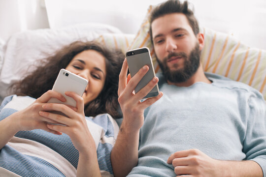 Couple spending time together in a bed