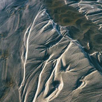 Detail of patterns in sand at low tide