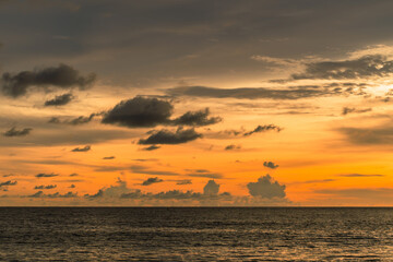 Naklejka na ściany i meble Beautiful sunset on the beach and sea, at Phuket Thailand.