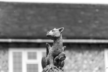 Gargoyle near stone house