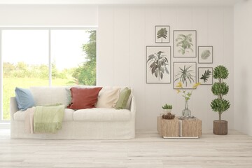 White living room with sofa and summer landscape in window. Scandinavian interior design. 3D illustration