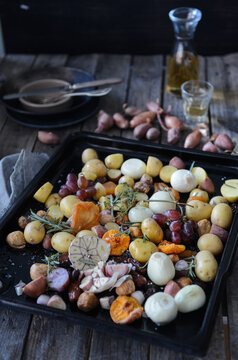 Potatoes, onion, garlic prepared to be roasted