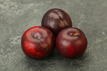 Ripe sweet plum fruit heap