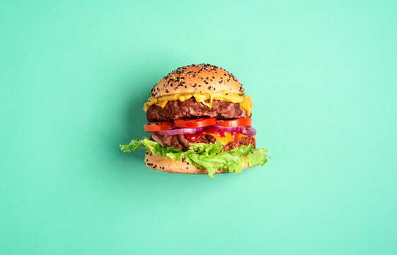 Hamburger On A Green Background, Top View. Burger Side View.