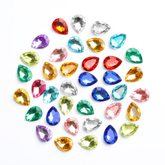 Different beautiful gemstones on white background, top view