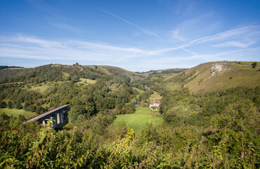 Fototapeta na wymiar Panoramic view of Monsal Dale and the Headstone Viaduct from Monsal Head in Derbyshire, UK on 14 September 2020