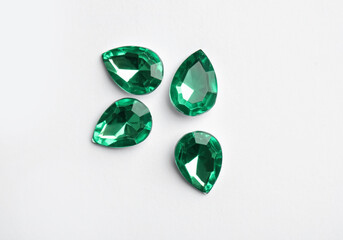 Beautiful gemstones on white background, top view