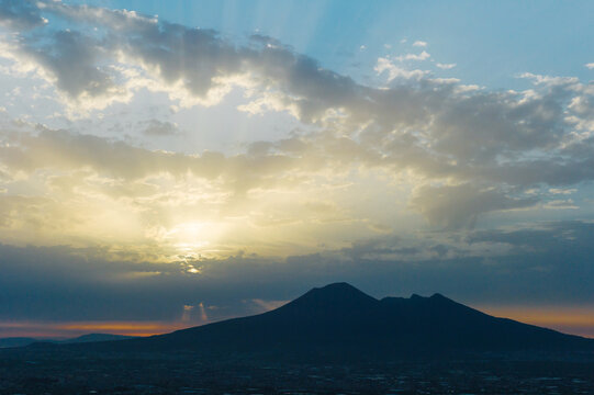 Volcano ""Vesuvius"" mountain in sunset lights