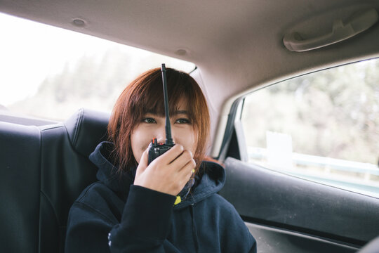 young lady sitting in the car