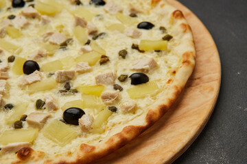 Delicious Italian pizza Hawaiian with pineapple and chicken