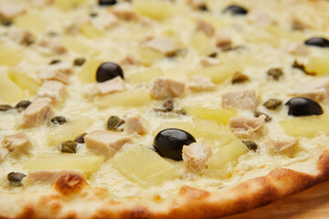 Delicious Italian pizza Hawaiian with pineapple and chicken