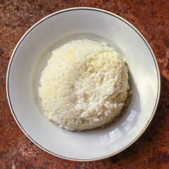 rice in a plate garnish on the table serving size top view place copy space for text keto or paleo diet